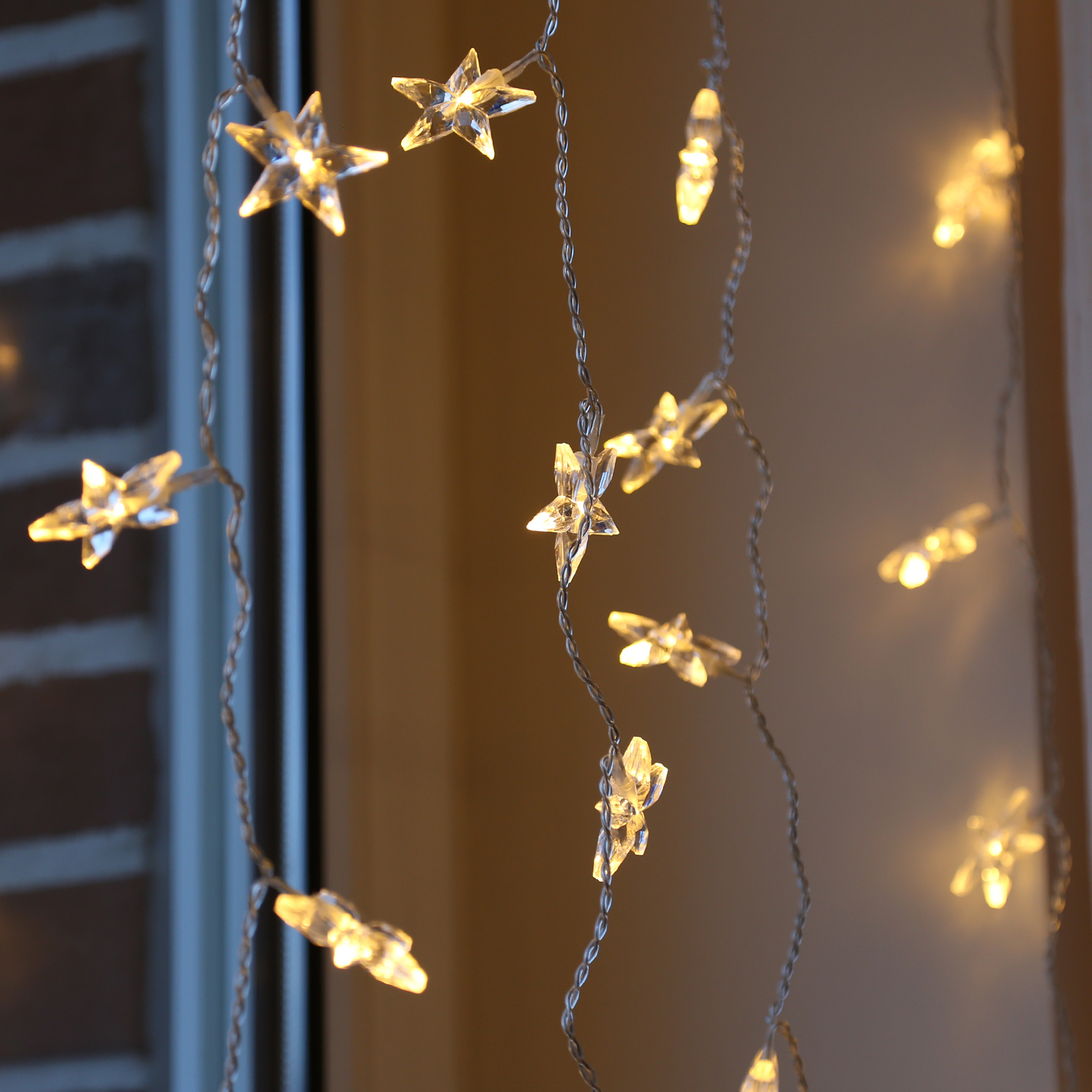 LED Lichtervorhang STERNE - 64 warmweiße LED - L: 1,2m - H: 1m - Trafo - für Innen - transparent LED Lichtervorhang STERNE - 64 warmweiße LED - L: 1,2m - H: 1m - Trafo - für Innen - transparent