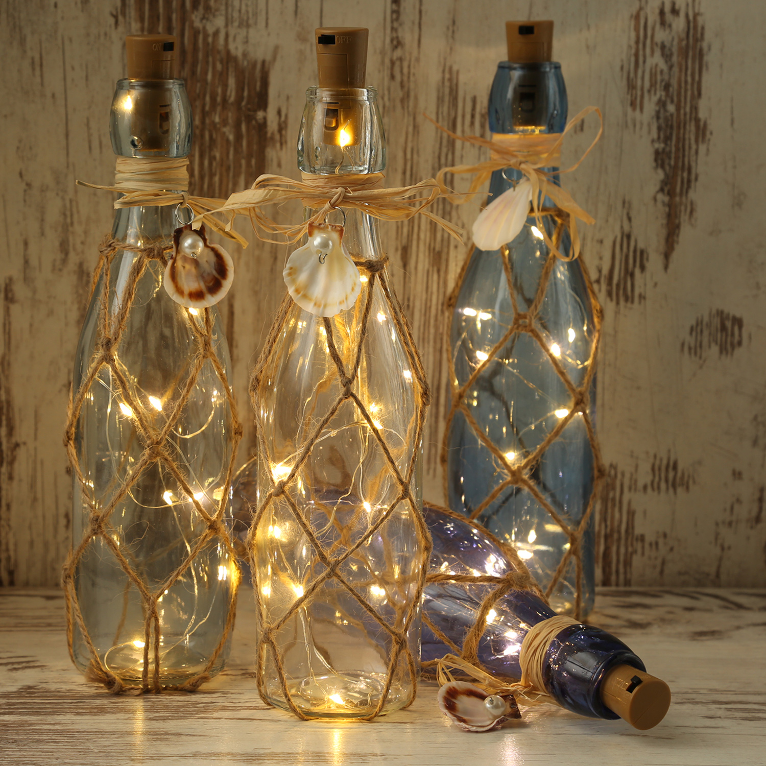 LED Dekoflasche MARITIM mit Juteseil - 10 warmweiße LED an Drahtlichterkette - H: 28cm - hellblau LED Dekoflasche MARITIM mit Juteseil - 10 warmweiße LED an Drahtlichterkette - H: 28cm - hellblau