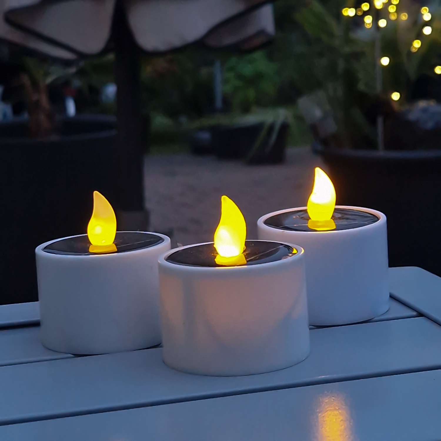 LED Solar Teelichter - orange flackernde LED - Lichtsensor - H: 6cm/D: 5,2cm - für Außen - 3er Set